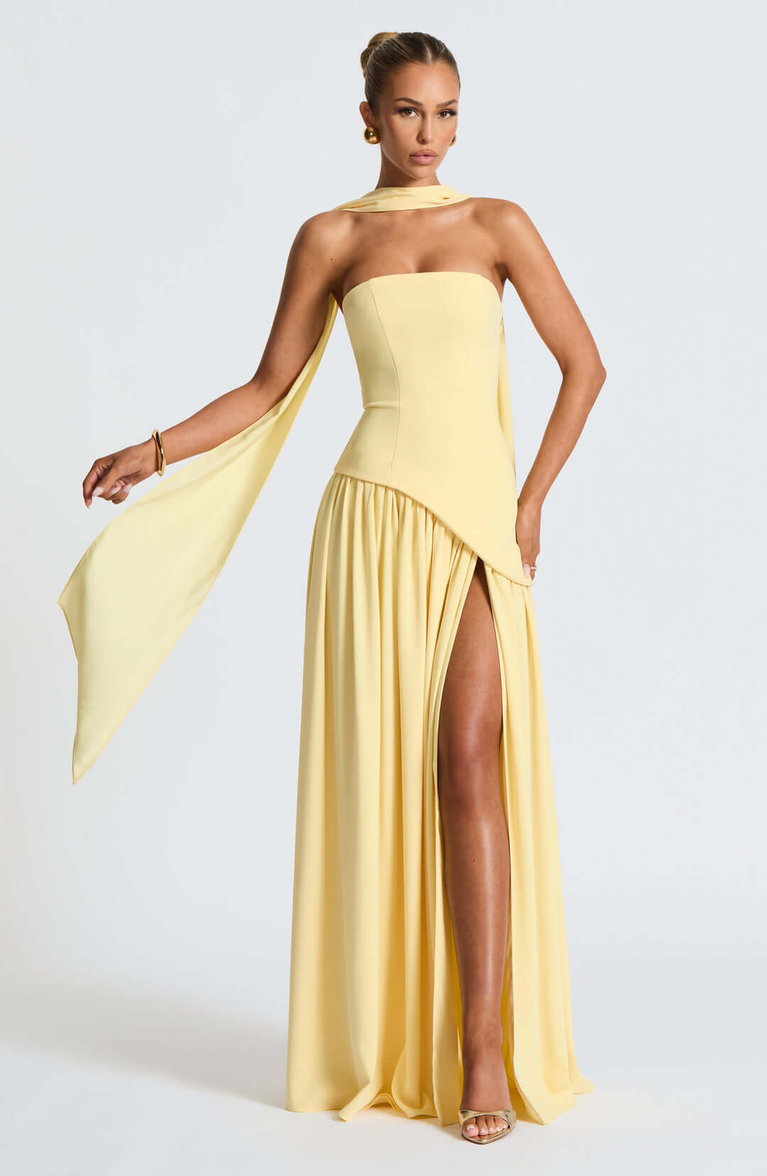 Strapless corset maxi gown featuring an asymmetrical draped skirt, perfect for elegant evening events and formal weddings. 0